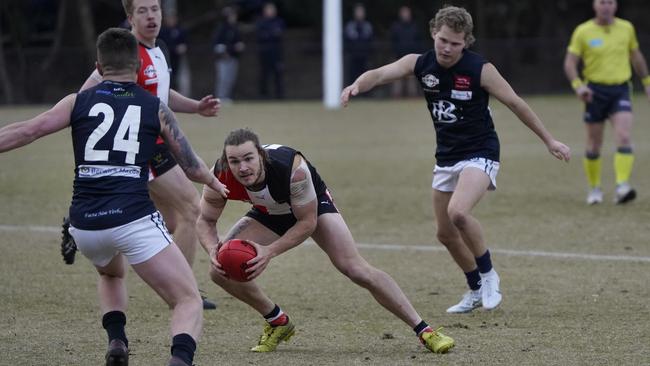 EFL: North Ringwood’s Liam Taylor is surrounded. Picture: Valeriu Campan