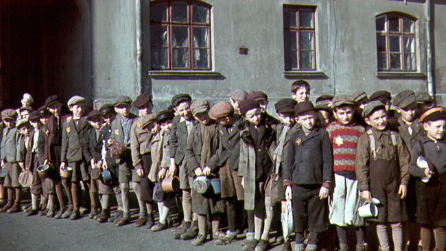 Jewish children at Lodz ghetto where many Auschwitz inmates were first herded to wait to be transferred to the Nazi concentration camp in Poland during World War Two, in a scene from TV documentary Auschwitz: The Nazis And The Final Solution.