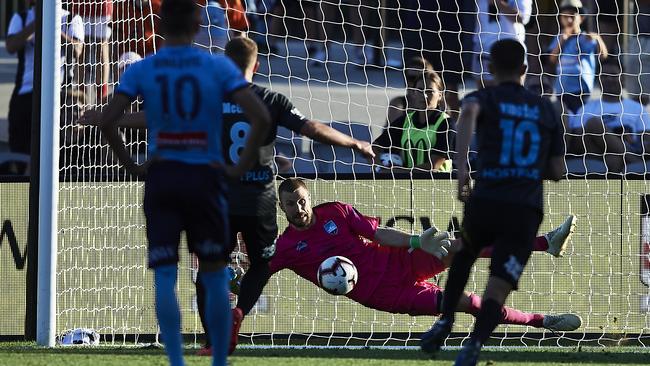 Sydney goalkeeper Andrew Redmayne saves a penalty against Melbourne City. Picture: Getty Images
