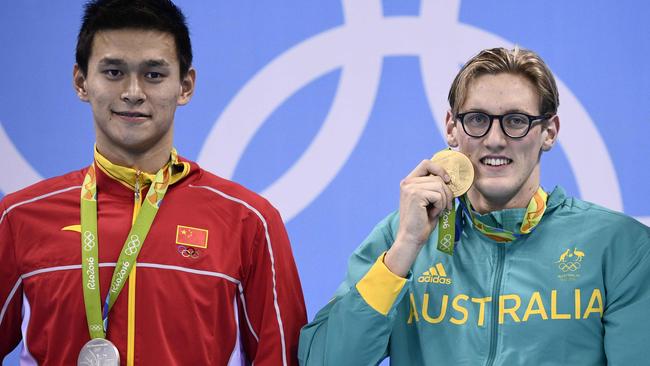 Australia's Mack Horton poses on the podium with silver medallist China's Sun Yang.