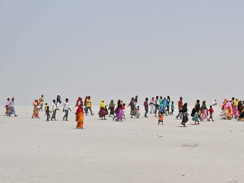 People travel towards a polling station to cast their ballot during the second phase of voting in India’s general election, in Gashbari village, Darrang district of Assam State, on April 26, 2024. Picture: AFP