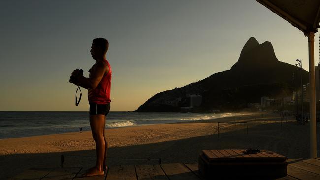 A lifeguard looks out over an empty Ipanema beac. Picture: AFP.