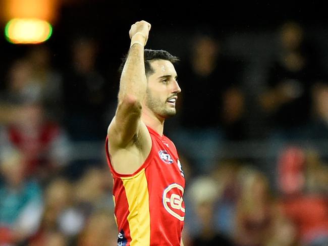 GOLD COAST, AUSTRALIA - MARCH 26: Brayden Fiorini of the Suns celebrates kicking a goal during the round two AFL match between the Gold Coast Suns and the Melbourne Demons at Metricon Stadium on March 26, 2022 in Gold Coast, Australia. (Photo by Matt Roberts/AFL Photos/Getty Images)