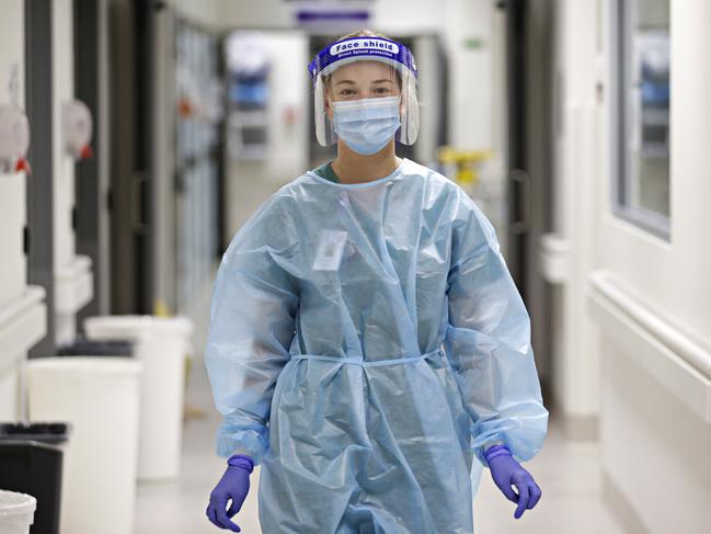 Nurses such as Anna-Louise Story wear specially designed personal protective equipment to work in the COVID ward at St Vincent’s Hospital. Picture: Adam Yip