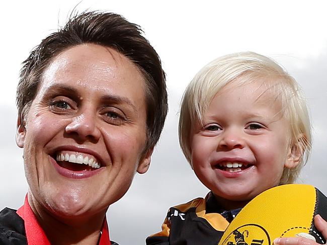 Glenelg's Courtney Gum took out the inaugural SANFL women's best & fairest award on Tuesday night. She is pictured with her son Buz, 2yrs,  at Glenelg Oval. Picture: Dylan Coker