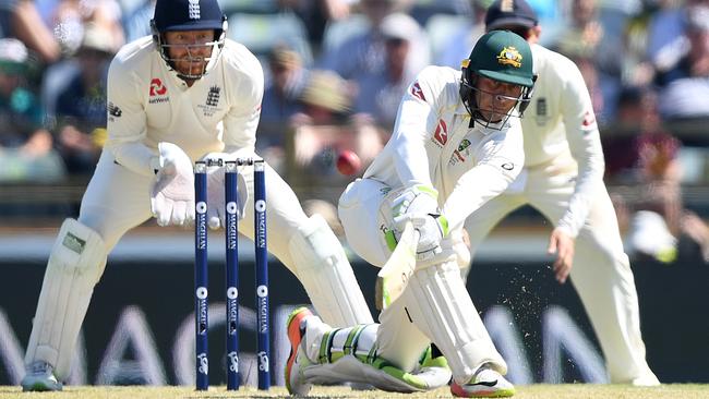 Australian batsman Usman Khawaja sweeps from the bowling of England's Moeen Ali. Photo: AAP