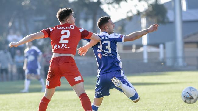 Shaun Harvey from Campbelltown and Nikolas Tsattalios from Sydney Olympic vie for the ball on Saturday. Picture: AAP Image/Morgan Sette