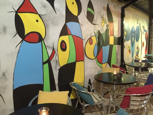 Lively wall decorations add colour to the Tapas Tapas Bodega experience.