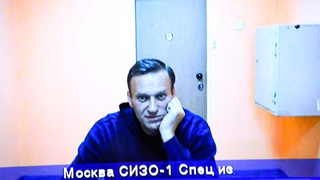 Alexei Navalny appears on a screen via a video link from Moscow's penal detention centre Number 1 during a court hearing on January 28. Navalny was detained on January 17 upon returning to Moscow after five months in Germany recovering from a near-fatal poisoning with a nerve agent, and later jailed for 30 days while awaiting trial for violating a suspended sentence he was handed in 2014. Picture: Alexander Nemenov/AFP