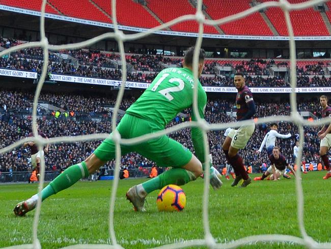 The ball goes under the body of Newcastle United's Slovakian goalkeeper Martin Dubravka from a shot from Tottenham Hotspur's South Korean striker Son Heung-Min (C) Tottenham's goal during the English Premier League football match between Tottenham Hotspur and Newcastle United at Wembley Stadium in London, on February 2, 2019. (Photo by Glyn KIRK / AFP) / RESTRICTED TO EDITORIAL USE. No use with unauthorized audio, video, data, fixture lists, club/league logos or 'live' services. Online in-match use limited to 120 images. An additional 40 images may be used in extra time. No video emulation. Social media in-match use limited to 120 images. An additional 40 images may be used in extra time. No use in betting publications, games or single club/league/player publications. /