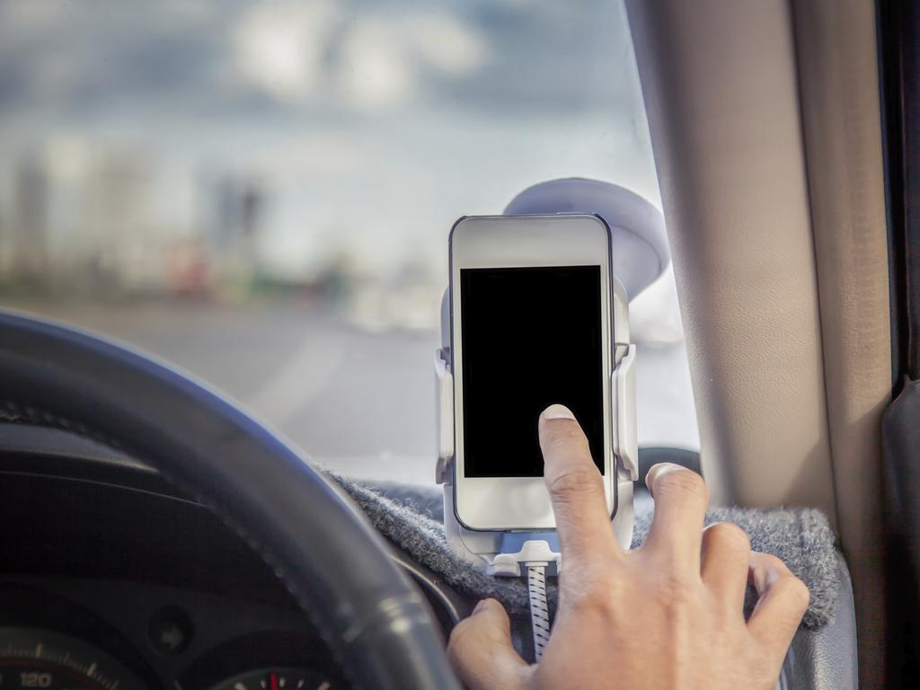 Drivers must have their phone mounted or be able to use it through voice activation if they wish to make calls while driving. Picture: iStock