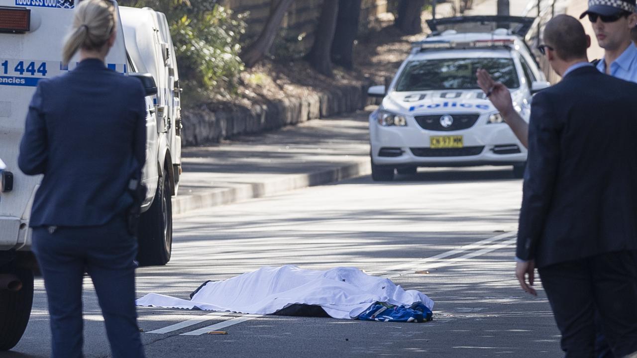 Jett McKee’s body lies on the road at Forest Lodge in 2018 after he was struck by a samurai sword. Picture: Brook Mitchell/Getty Images