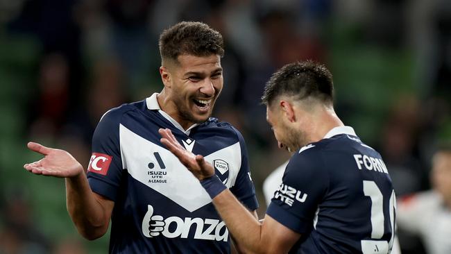 Zinedine Machach (left) celebrates a goal with his Melbourne Victory teammate Bruno Fornaroli. Picture: Jonathan DiMaggio/Getty Images