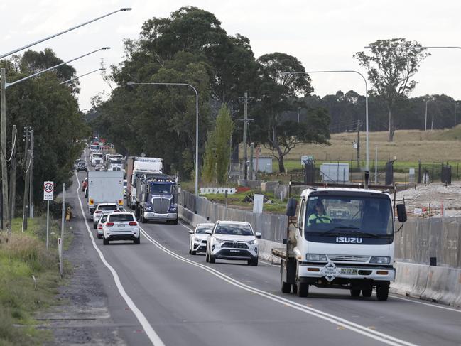 Traffic last month on Mamre Rd, Kemps Creek, which has been singled out in the budget for upgrade. Picture: Richard Dobson