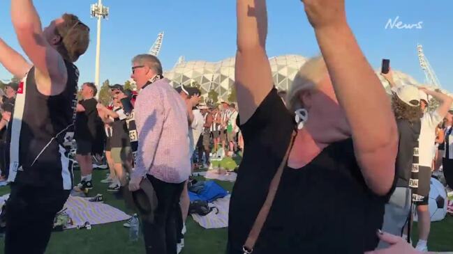 Moment Collingwood fans rejoice over Grand Final win