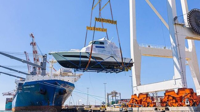 Riviera craft being loaded onto a ship being taken to the US.