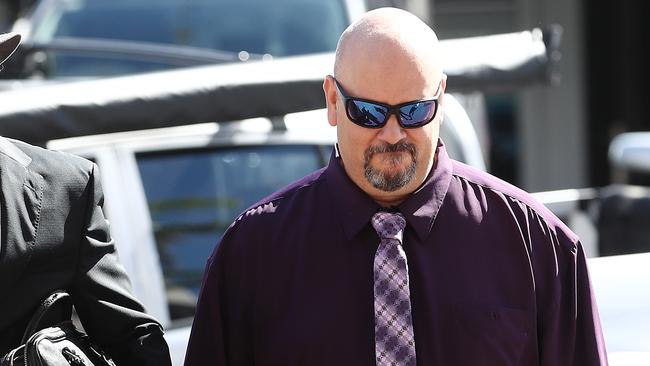 Michael Glenn Lewis (right) enters Cairns court house with his solicitor Derek Perkins. Picture: Brendan Radke