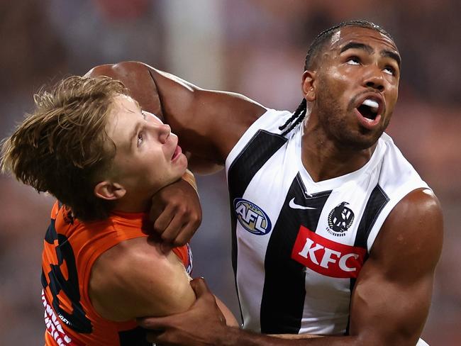 SYDNEY, AUSTRALIA - MARCH 09: Harvey Thomas of the Giants and Isaac Quaynor of the Magpies contest for the ball during the AFL Opening Round match between Greater Western Sydney Giants and Collingwood Magpies at GIANTS Stadium, on March 09, 2024, in Sydney, Australia. (Photo by Cameron Spencer/Getty Images)