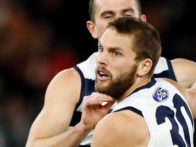 MELBOURNE, AUSTRALIA - JUNE 03: Tom Atkins of the Cats celebrates a goal with teammates during the 2022 AFL Round 12 match between the Western Bulldogs and the Geelong Cats at Marvel Stadium on June 03, 2022 in Melbourne, Australia. (Photo by Dylan Burns/AFL Photos via Getty Images)