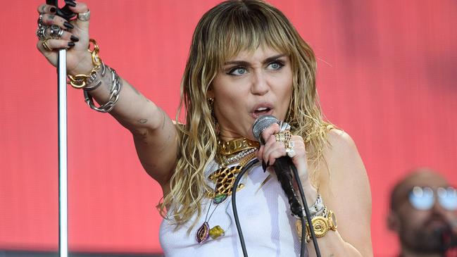 Performer Miley Cyrus has said she’s been cleaning as a way to kill time during her self-isolation. Picture: Leon Neal/Getty