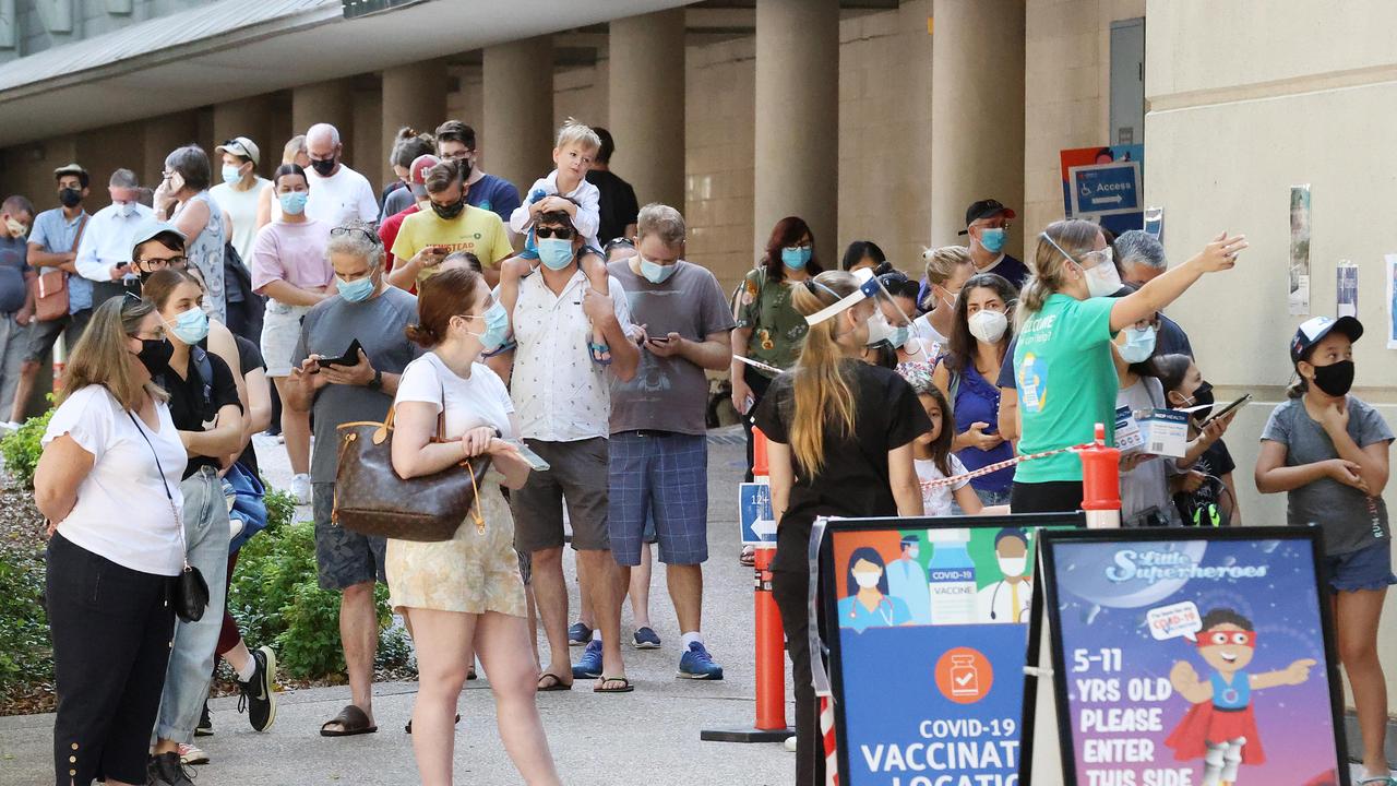 The line-up for Covid-19 vaccinations at Brisbane Convention Centre.