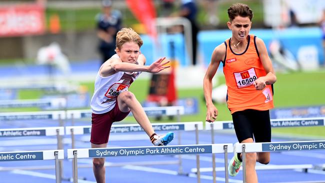 Ethan McErlane tackling the hurdles.