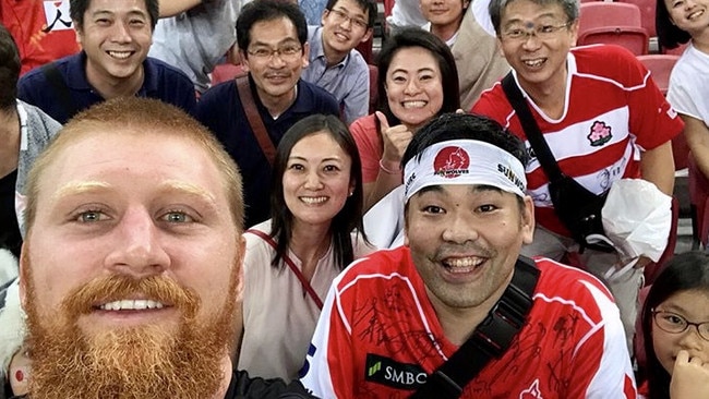 Ed Quirk takes a selfie with Sunwolves fans. 