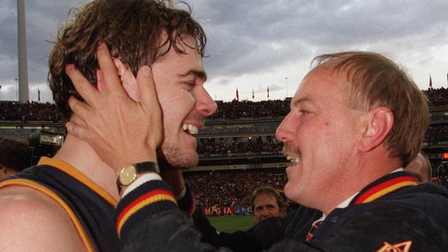 Happier times .... Malcolm Blight congratulates David Pittman after the Crows had captured their first premiership with a win over St Kilda in 1997