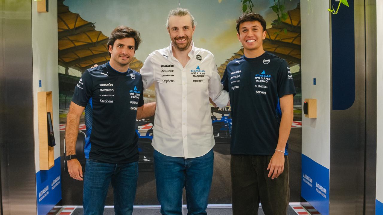 Atlassian CEO Mike Cannon-Brookes with Williams drivers Carlos Sainz and Alex Albon.