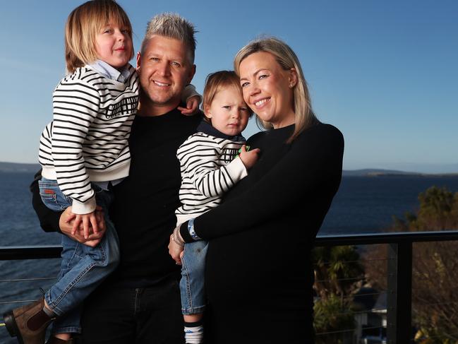 Chef Massimo Mele at their waterfront home in Taroona, with children Rio, 2, and Max, 5, and wife Kristy. Picture: NIKKI DAVIS-JONES