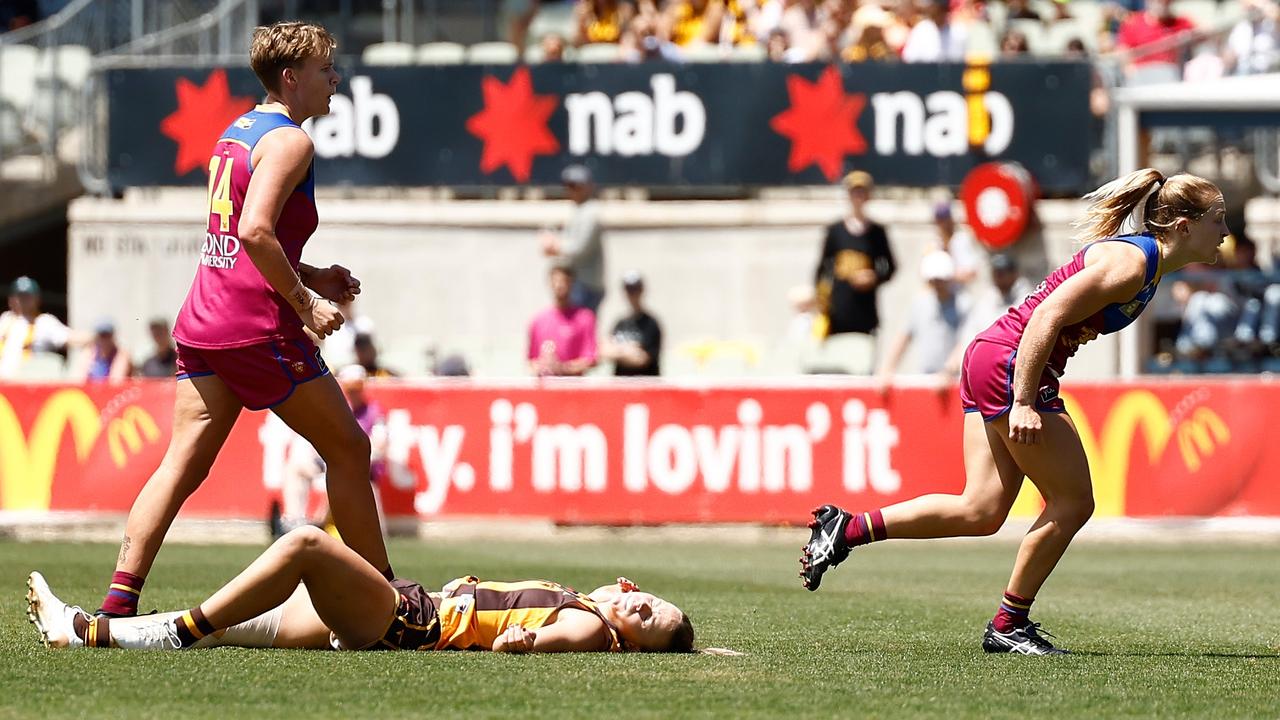 Brisbane midfielder Belle Dawes (right) is challenging her one-match suspension for a high bump on Hawthorn defender Ainslie Kemp. Picture: Michael Willson / Getty Images