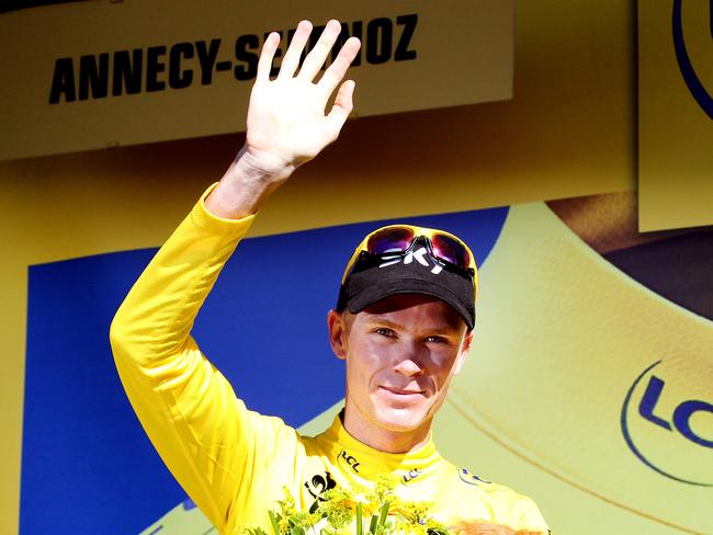 Tour de France - Stage 20 - Annecy to Annecy Semnoz - Christopher Froome stands on the podium with the yellow jersey that he will wear into Paris tomorrow