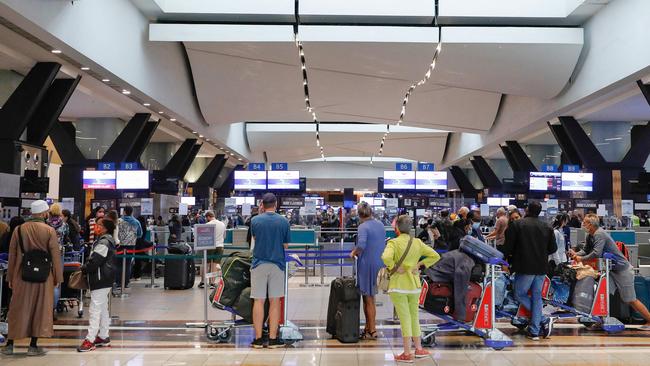 Travellers at Johannesburg airport after several countries banned flights from South Africa following the discovery of the Omicron variant. Picture: AFP