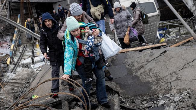 Residents of Irpin flee heavy fighting as Russian forces enter the city. Picture: Getty Images.