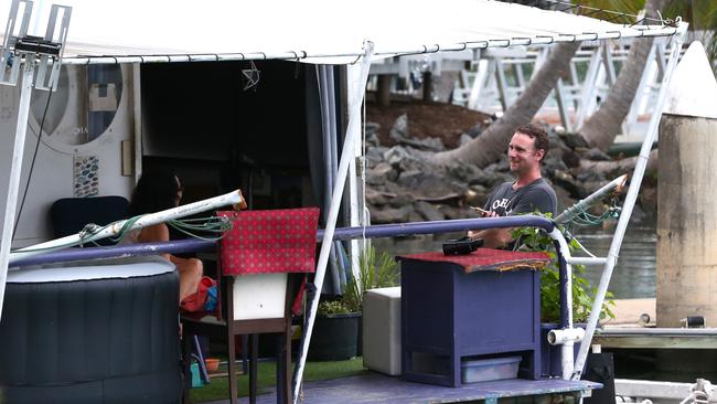 The houseboat of former Hollywood stunt woman Tiffiny Lynn remains the only vessel at the Quicksilver Marina at Port Douglas as Cyclone Jasper advances toward the coast. Cairns Post reporter Luke Williams talks to Ms Lynn about the approaching storm. Picture: Peter Carruthers