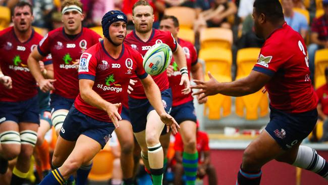 Reds five-eighth Hamish Stewart makes a pass against the Lions at Suncorp Stadium.