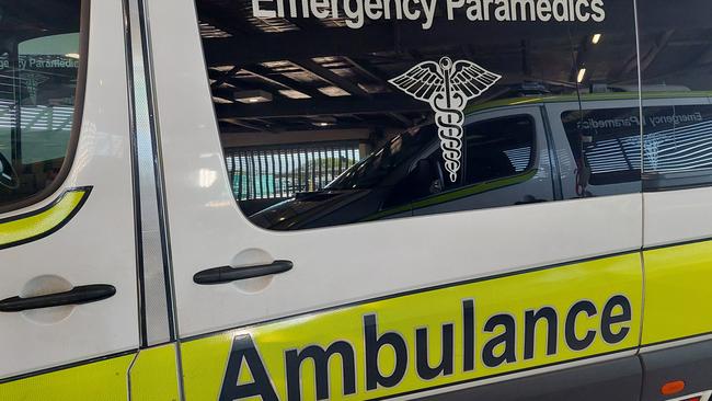 A patient is being assessed for injuries following a caravan rollover at Tansey on Saturday morning.