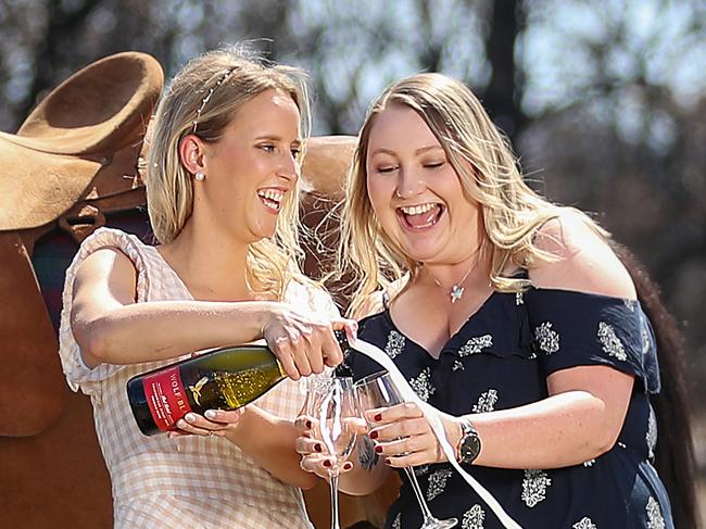 HOLD FOR HERALD SUN PIC DESK----East Gippsland tourism in fire affected areas, in attempts to draw the crowds back to seaside locations and small country towns. Buchan. Candice Wigney and Grace Kenyon, along with Firefree the racehorse, gearing up for the Buchan Races.   Picture: Alex Coppel.