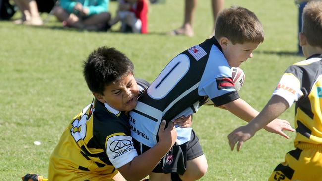 Junior rugby league, Bribie Island. Warrigals v Caloundra JRLFC. Under 7, Jackson Bates caught in a tackle