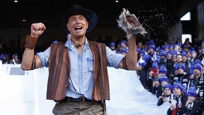 Terry Daniher revs the crowd up before his slide. Picture: Getty Images