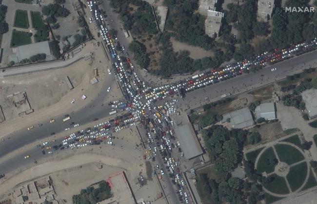 This handout satellite image released by Maxar Technologies shows a traffic jam and crowds, during the chaotic scene at Kabul Airport. Picture: Maxar Technologies/AFP