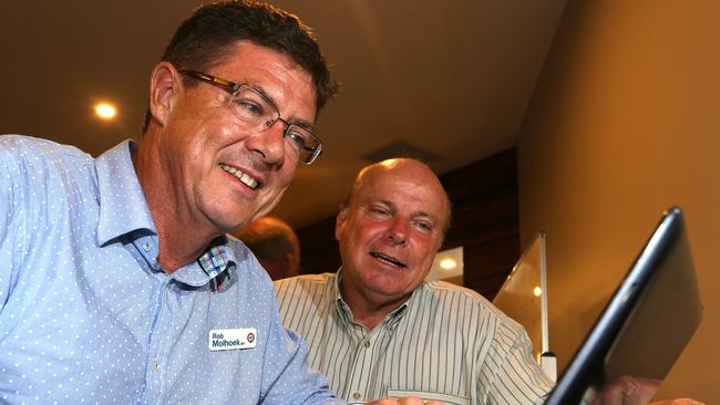 Southport LNP member Rob Molhoek and campaign manager James Kennett watch the numbers at the post election party at Parkwood Golf Club. Picture Glenn Hampson