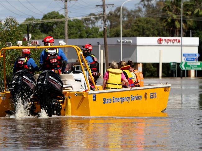 The SES shift people whose homes were affected by major flooding in Forbes. Picture: Dean Marzolla