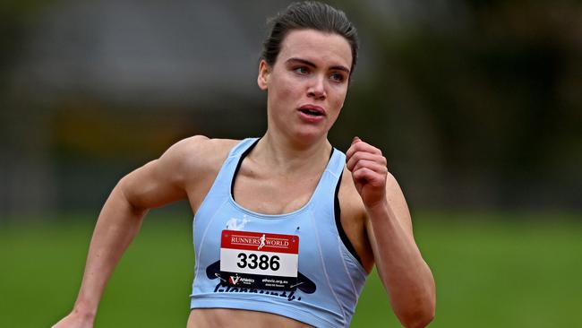 Jennifer King powers through her 200m run. Picture: Andy Brownbill