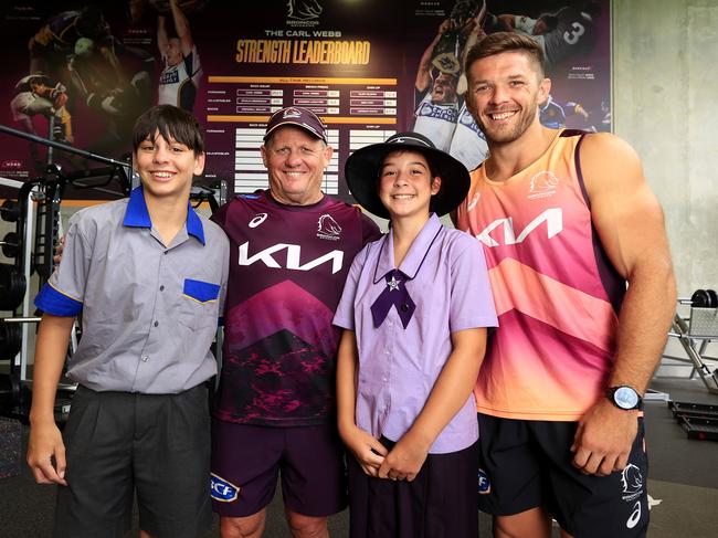 Kevin Walters and Corey Jensen with Carl Webb’s children Hunter and Brooklyn. Picture: Adam Head