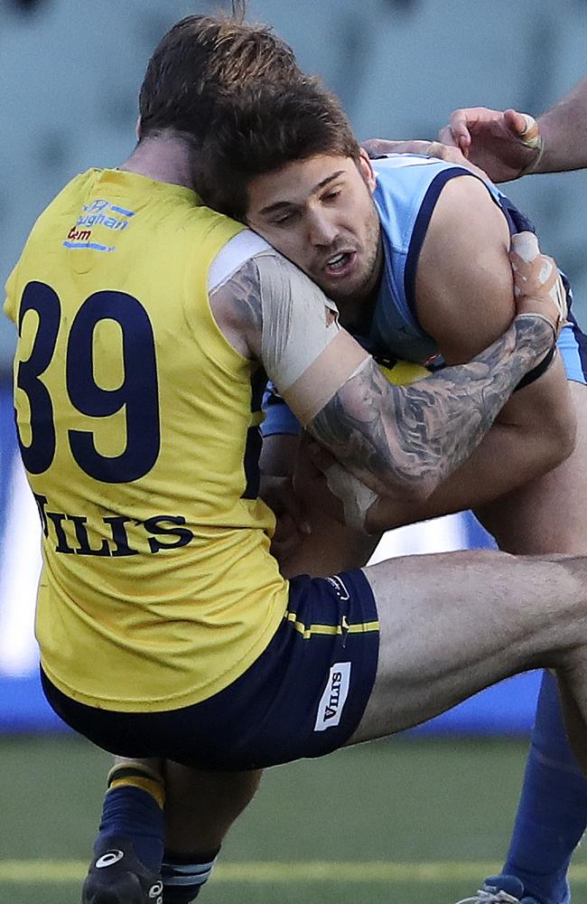 Sturt’s James Battersby runs into Jack Firns of the Eagles in the qualifying final. Picture Sarah Reed