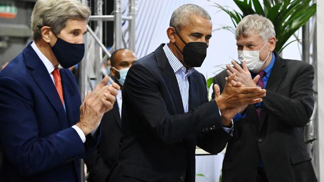 Former US President Barack Obama (C) and United States Special Presidential Envoy for Climate, John Kerry (L) meet delegates and activists in the US pavilion during the COP26 UN Climate Change Conference. Picture: Jeff J Mitchell/Getty Images