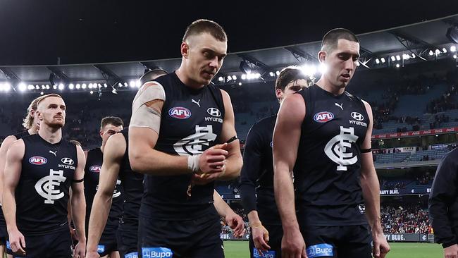 Disappointed Carlton players head to the rooms after the loss to Essendon. Picture: Michael Klein.