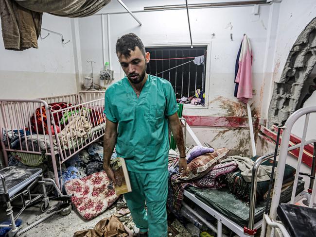 A man inspects the damage in a room following Israeli bombardment at Nasser hospital in Khan Yunis in the southern Gaza Strip on December 17, 2023, amid ongoing battles between Israel and the Palestinian militant group Hamas. Picture: AFP