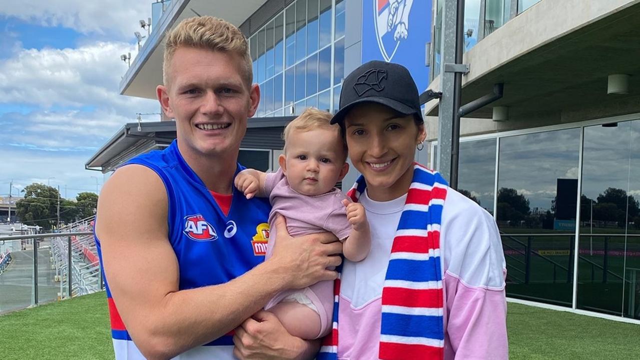 New Western Bulldog player Adam Treloar and wife Kim Ravallion and daughter Georgie at the home of the Western Bulldogs